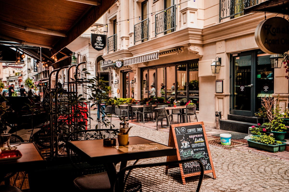 Outdoor café seating on a sunny Portland street